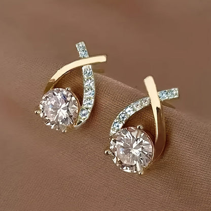Oorbellen met gouden kruis en zirconia