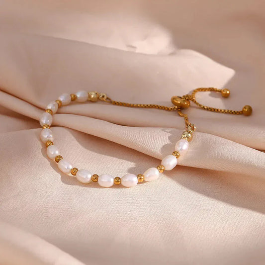 Elegante parel en gouden armband