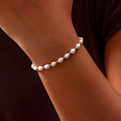 Elegante parel en gouden armband