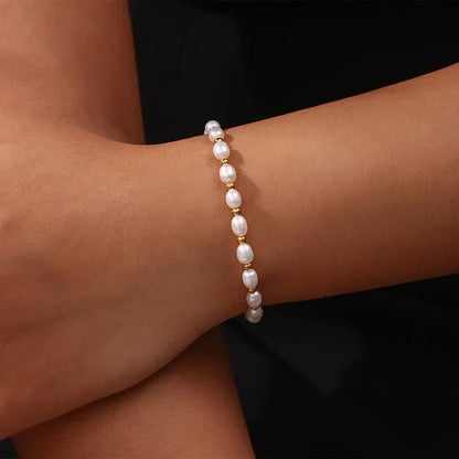 Elegante parel en gouden armband