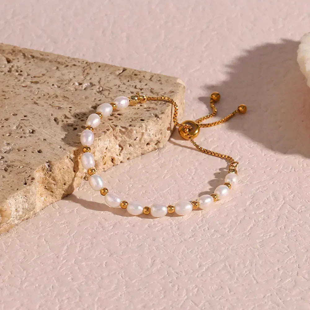 Elegante parel en gouden armband