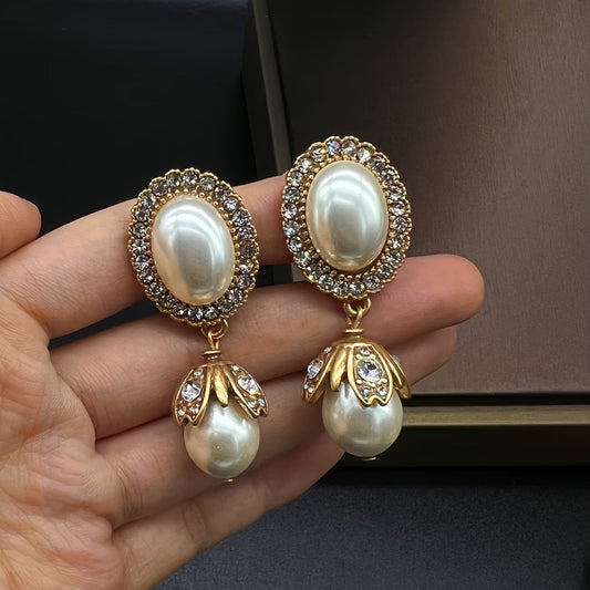 Vintage oorbellen met parelframe