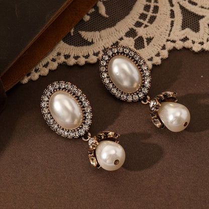 Vintage oorbellen met parelframe