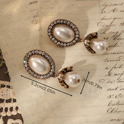 Vintage oorbellen met parelframe